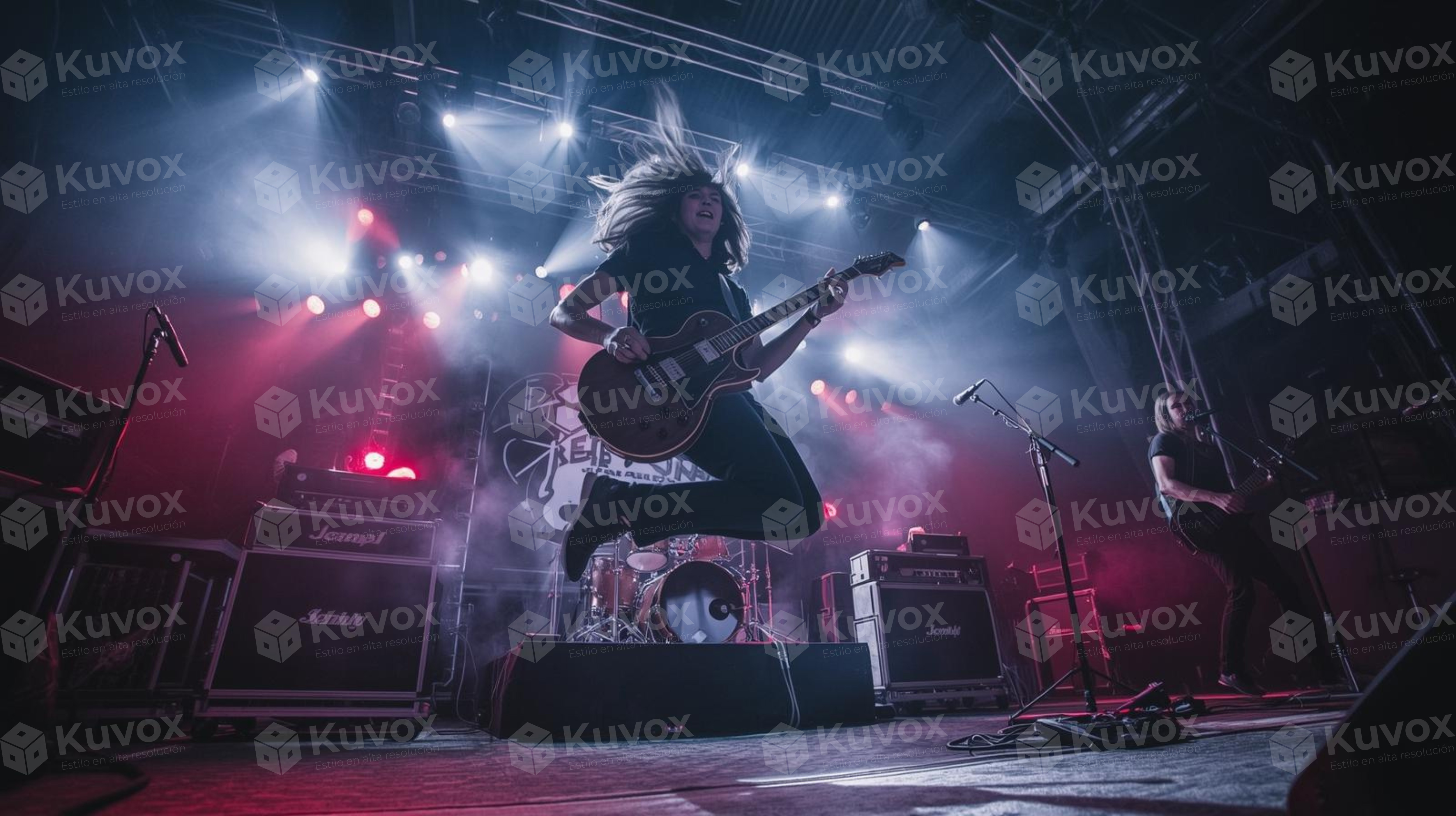 Guitarrista saltando en el escenario